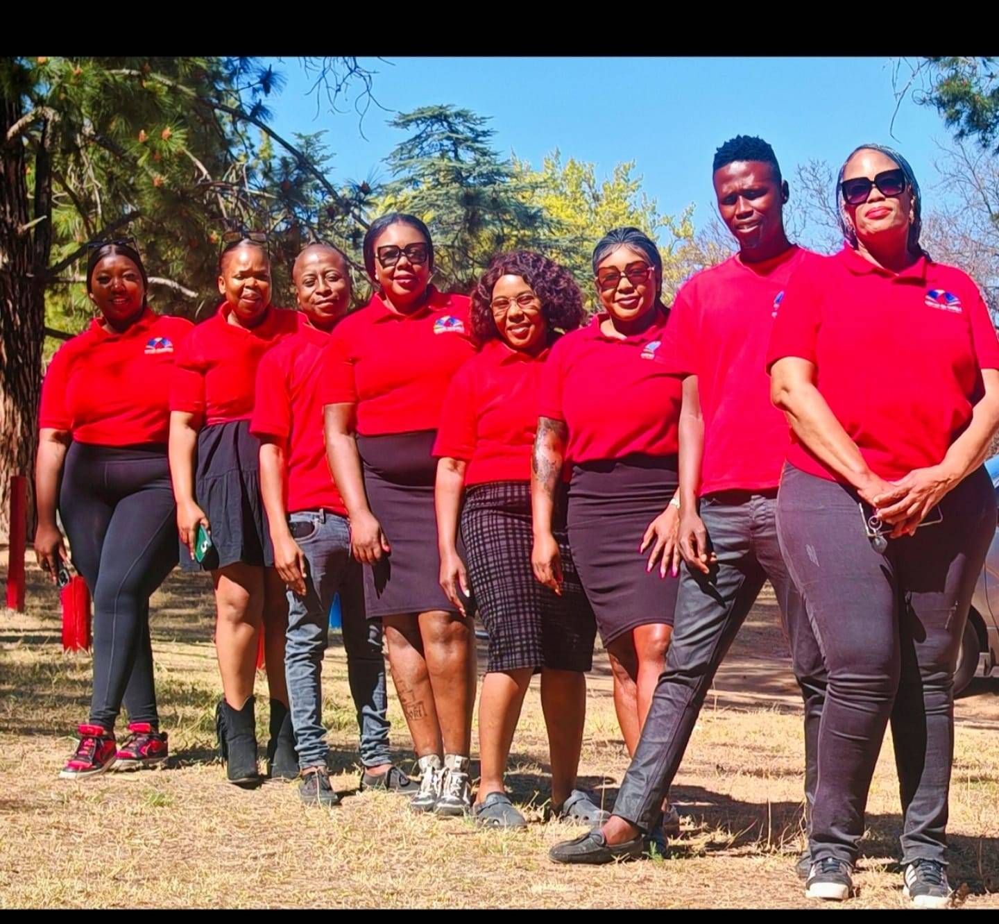 Mini Me on Wheels drivers lined up in branded red uniforms