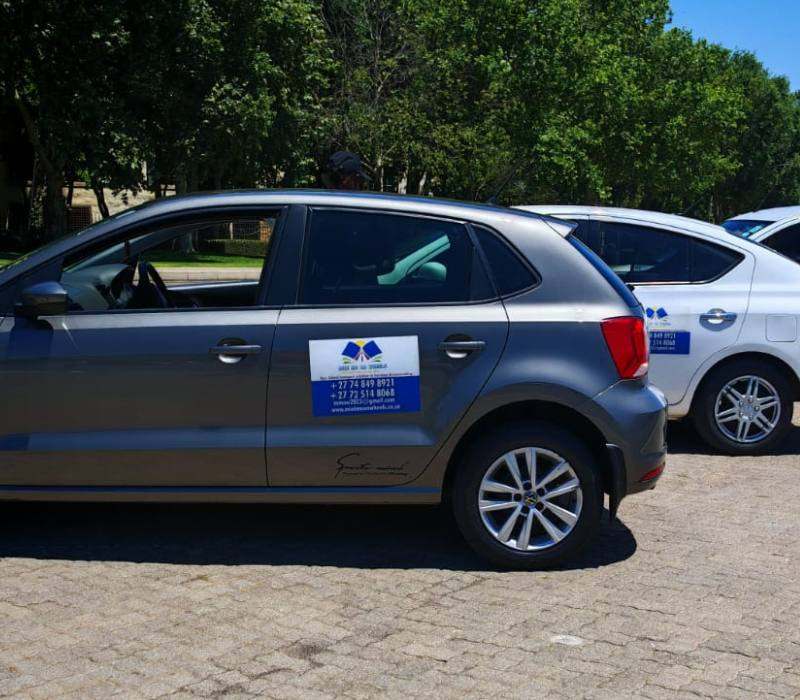 Grey VW Polo with Mini Me on Wheels school transport branding